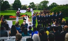 Outdoor wedding ceremony on the grounds of the Hilton Chicago Oak Brook Hills Resort
